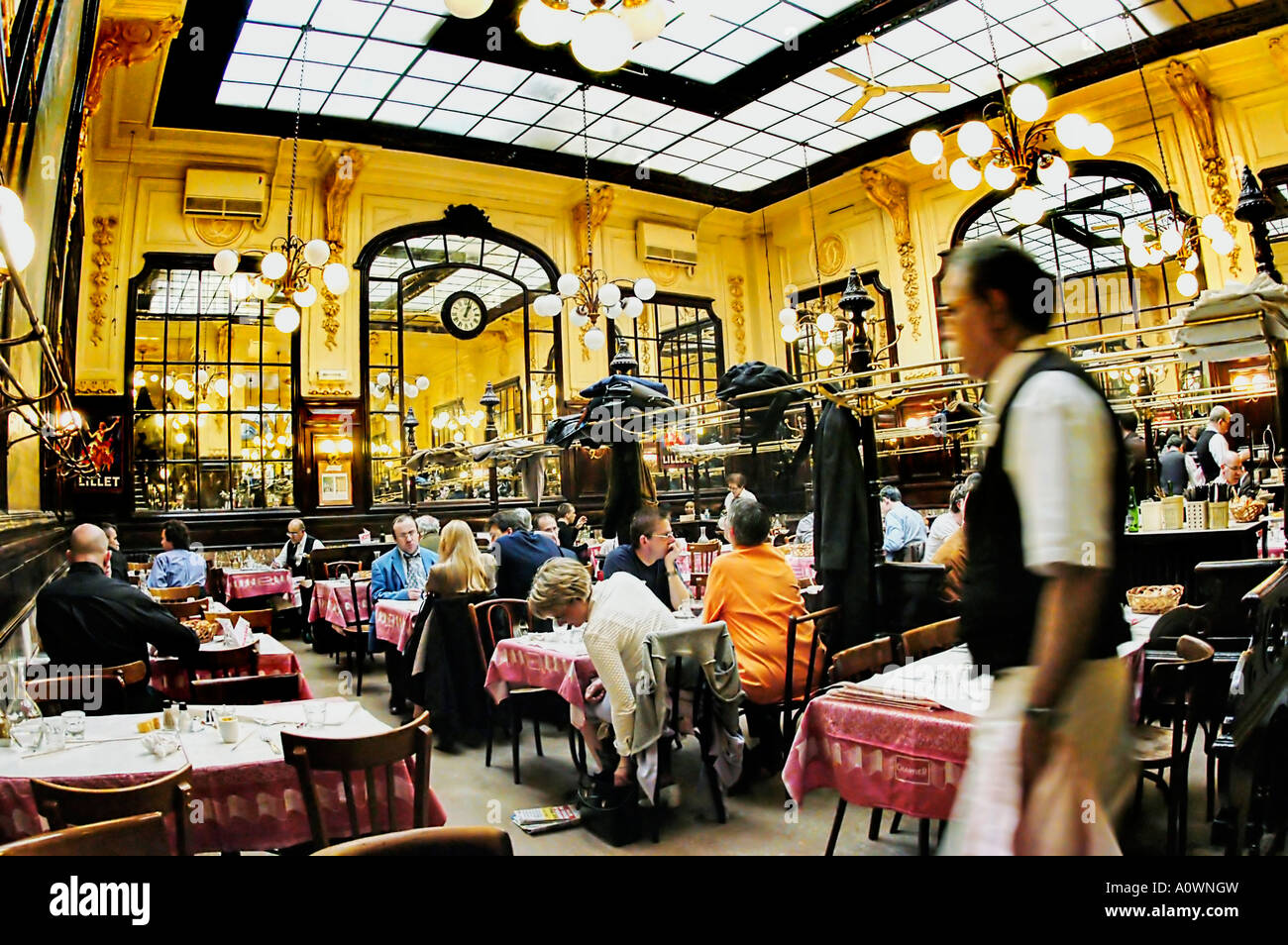 PARIS France, people Sharing Meals in 'Chartier'  French Brasserie Restaurant, Inside with Waiter Serving Customers Interior, european restaurant, Stock Photo