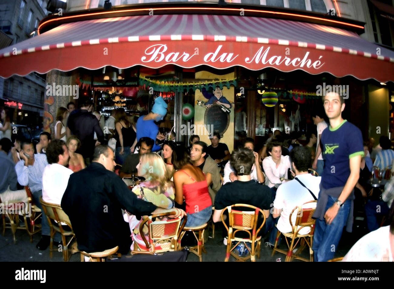 PARIS, France, Crowd People Sharing Drinks on Sidewalk Terrace Paris French Café Bar Bistro Restaurant in Latin Quarter 'Bar de Marché' Stock Photo