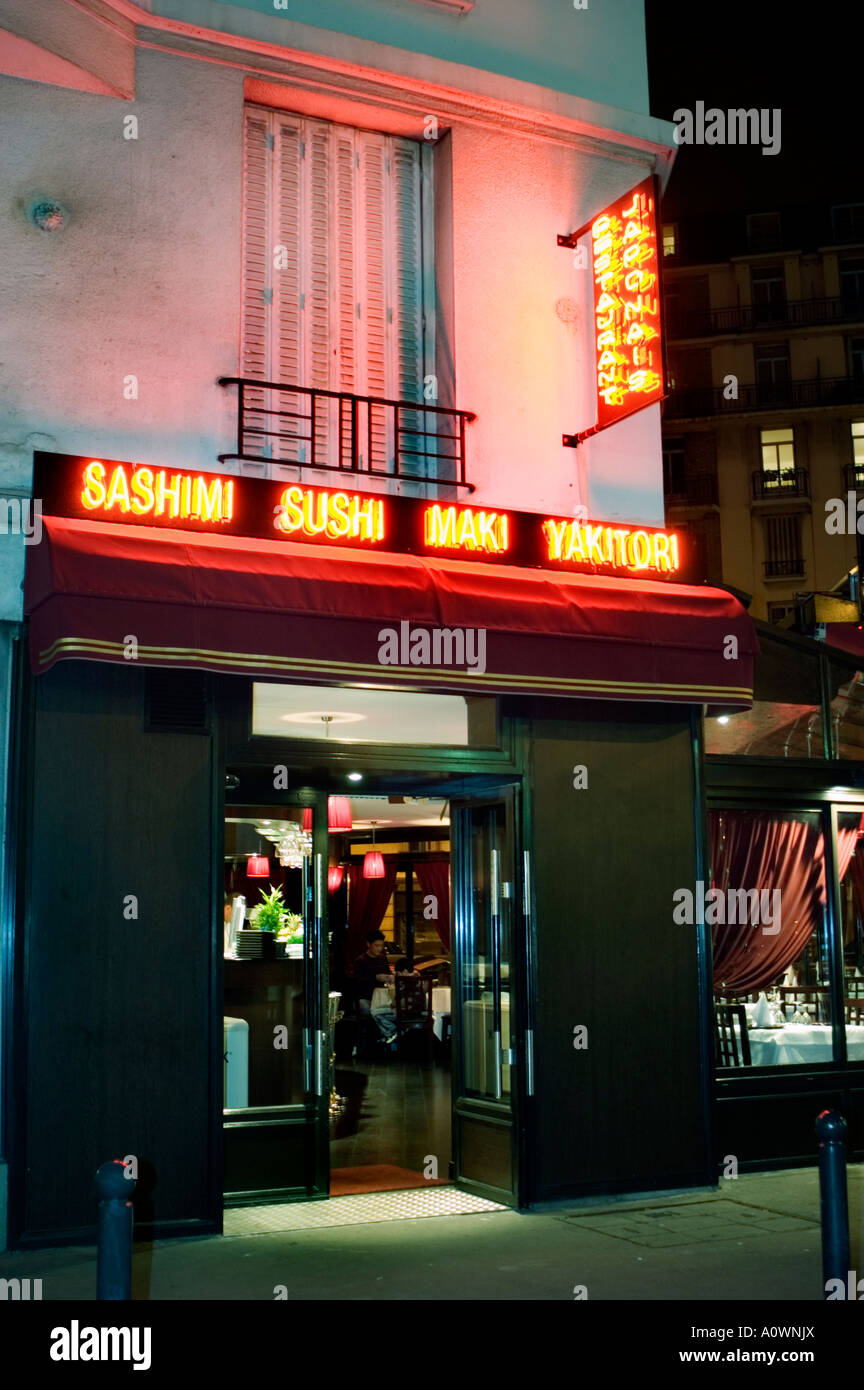 PARIS France, Japanese Restaurant Exterior, Neon Sign, Open Door, at Night Entrance 'Sakura' Stock Photo