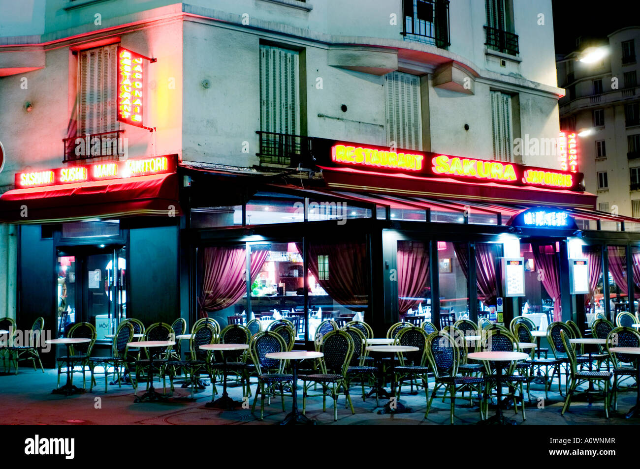 paris france japanese restaurant exterior lit up at night stock