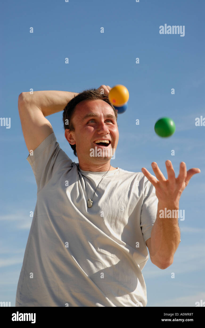 Juggler practices his skills in the open air Stock Photo Alamy