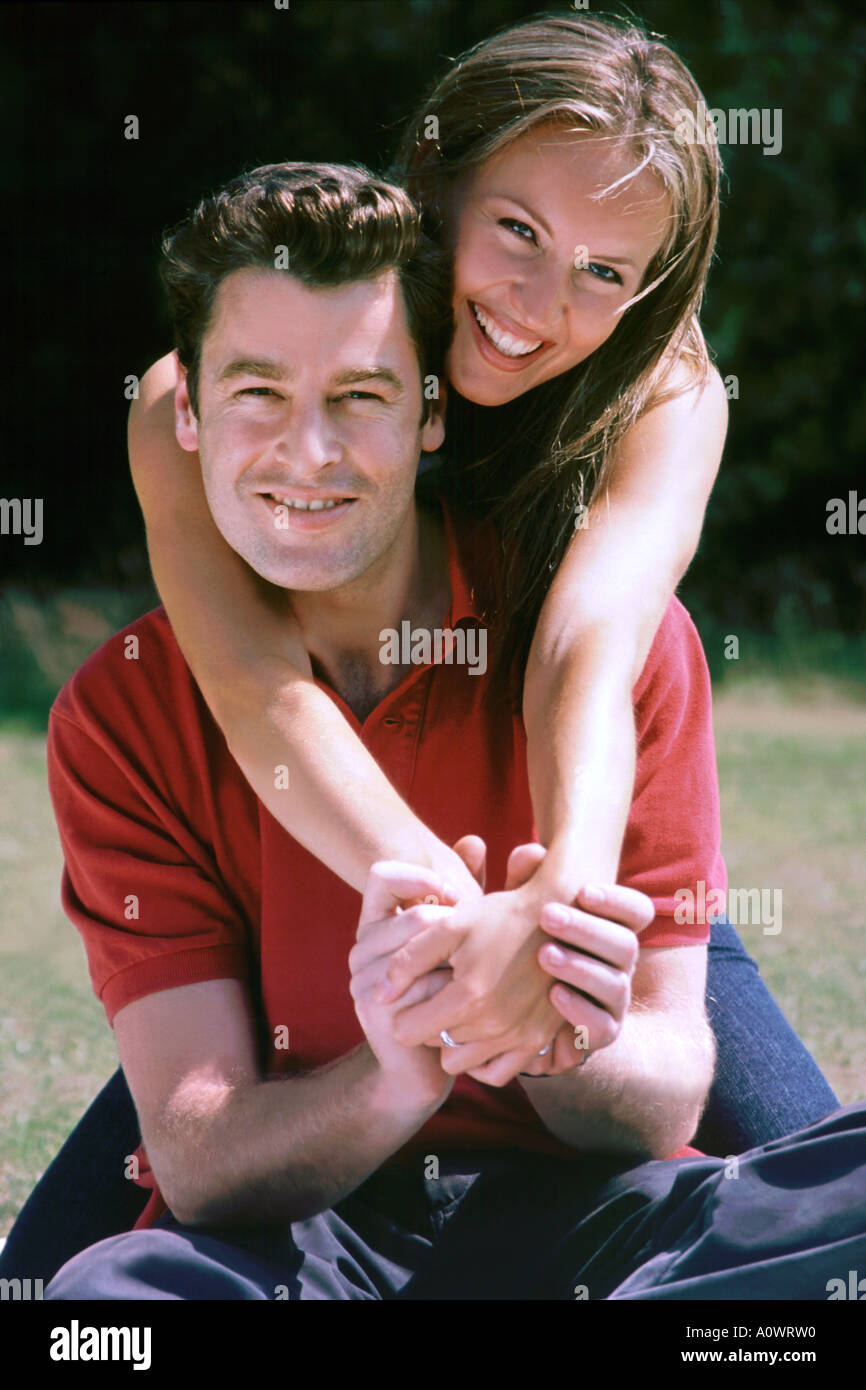 Couple cuddling in the park. Stock Photo