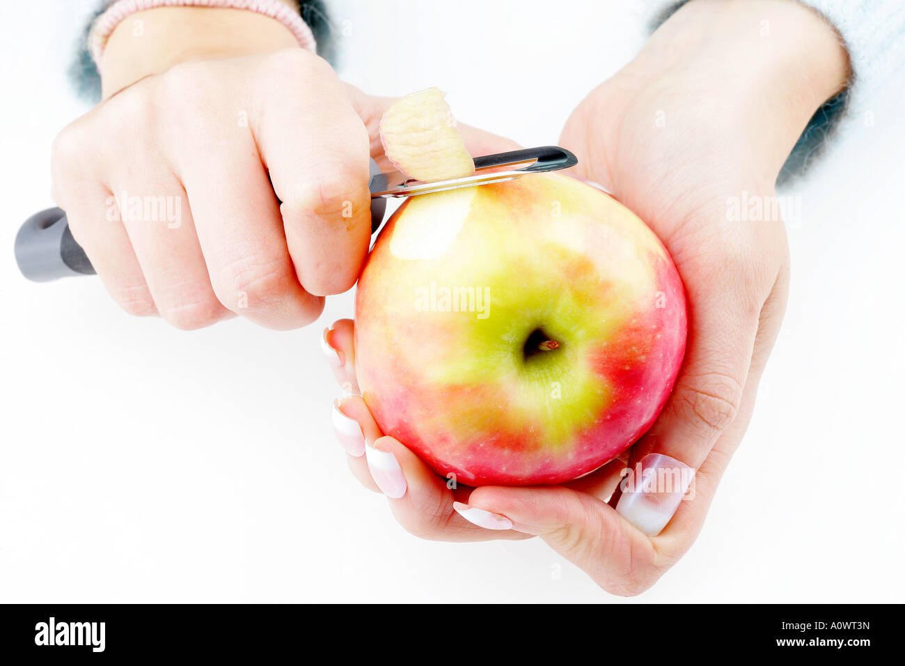 Woman Peeling an Apple Stock Photo - Alamy