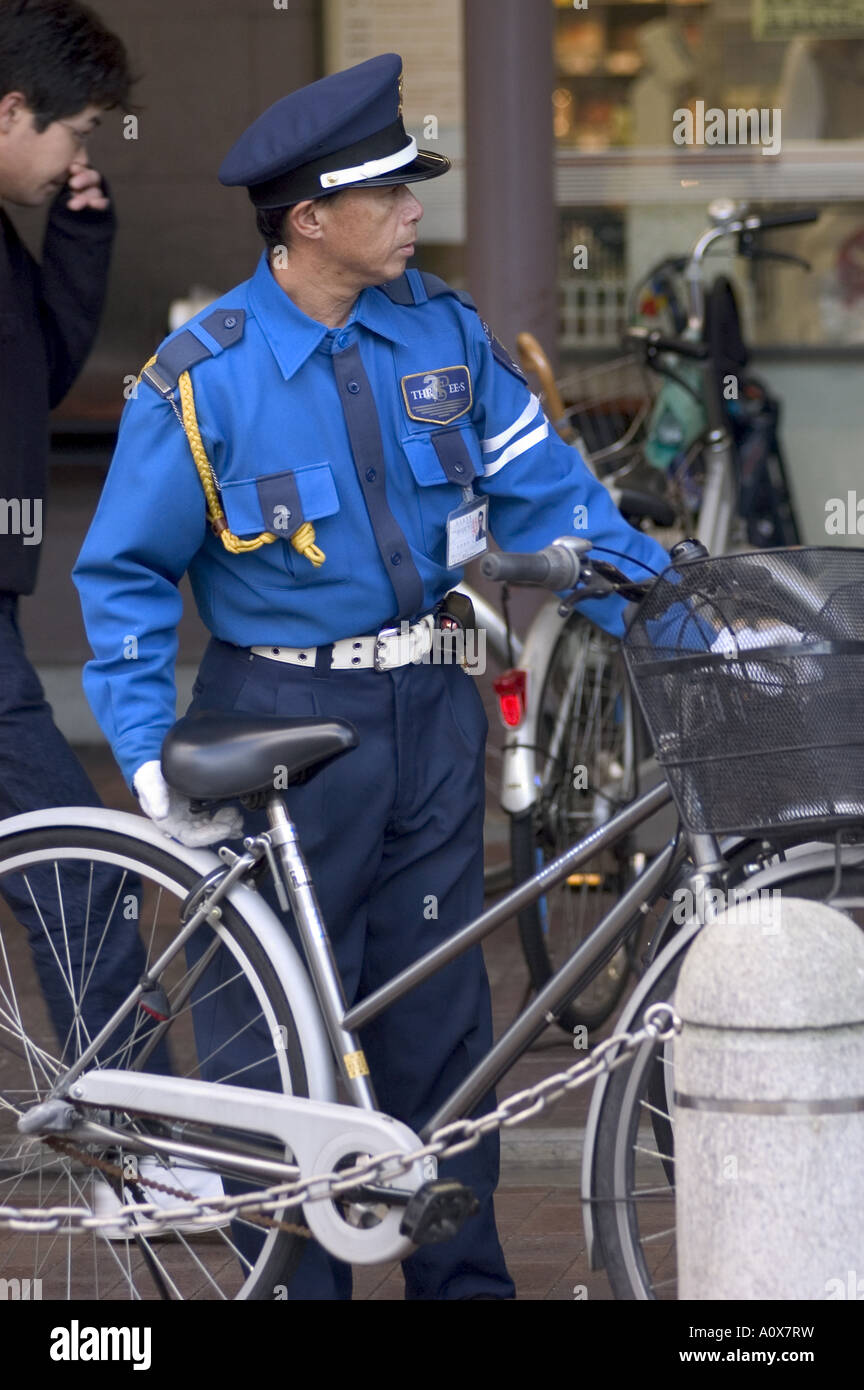 Policeman with bicycle Kyoto city Honshu Japan Asia Stock Photo