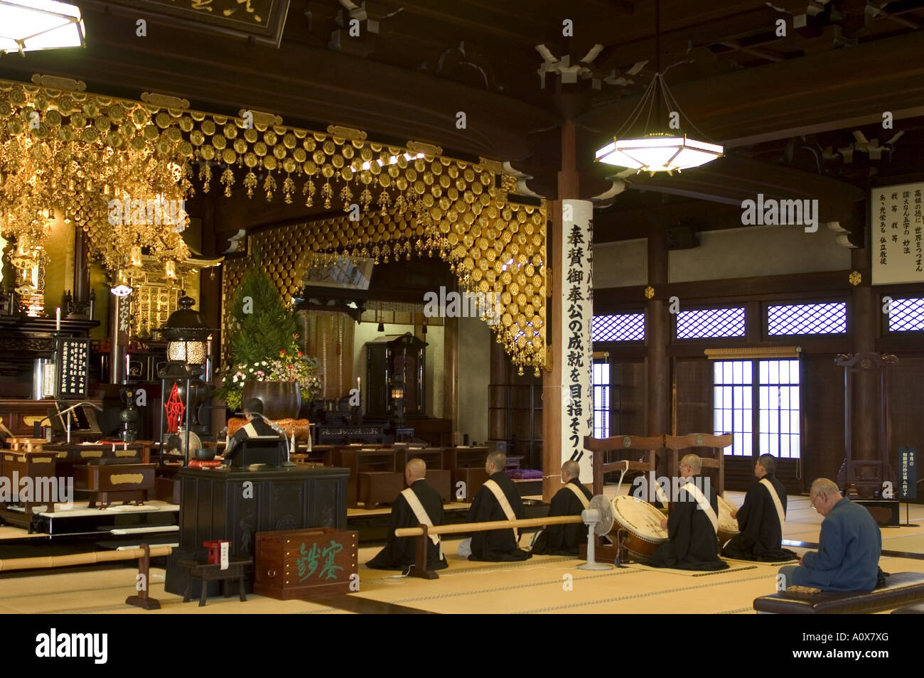 Buddhist monks performing prayers music hires stock photography and