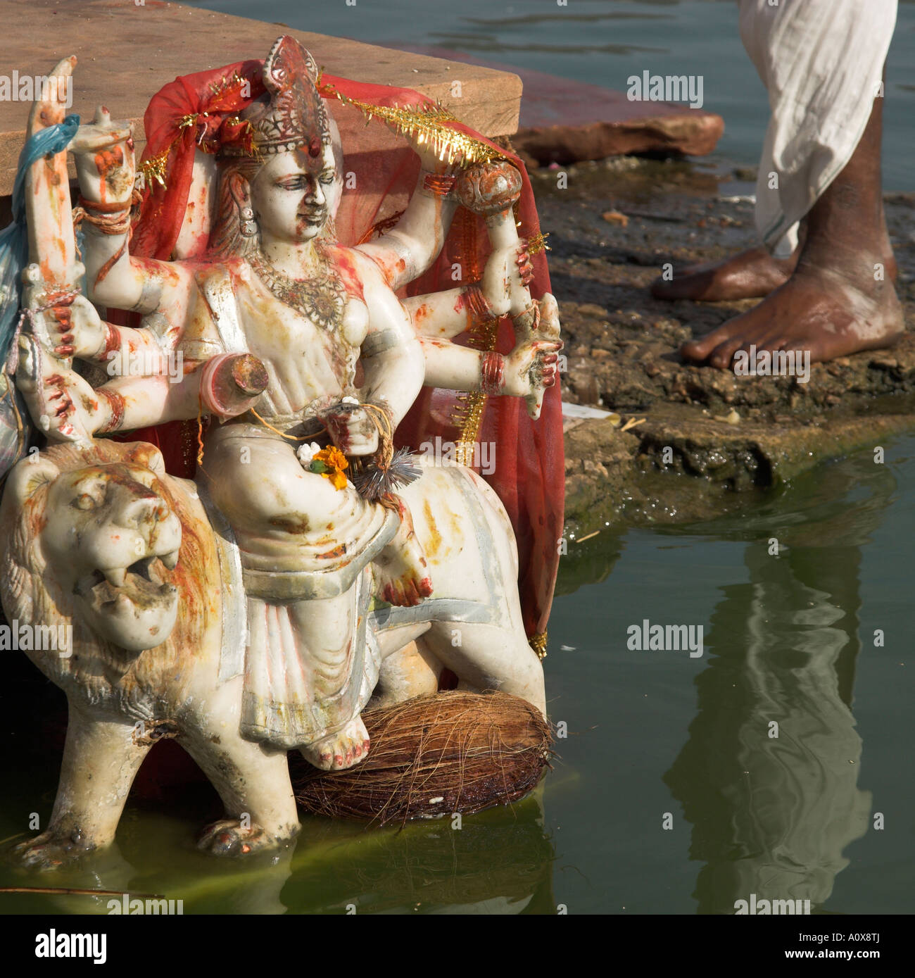 India Rajasthan Pushkar On the bank of the sacred lake where a lotus thrown by Brahma landed close up of a little statue of Durg Stock Photo