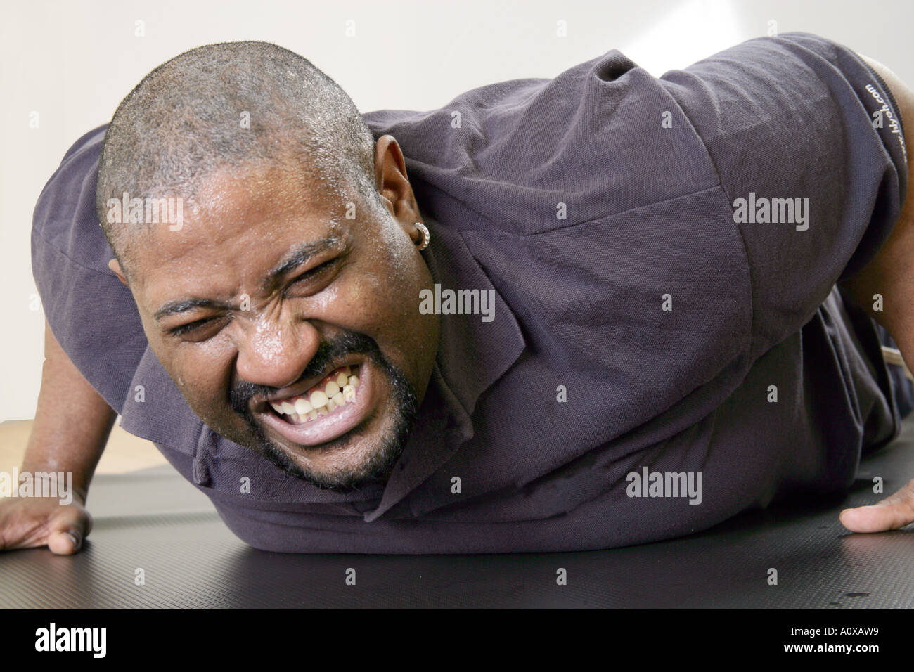 Man working out doing push-ups. Exercise is important for a healthy body and healthy mind. Stock Photo