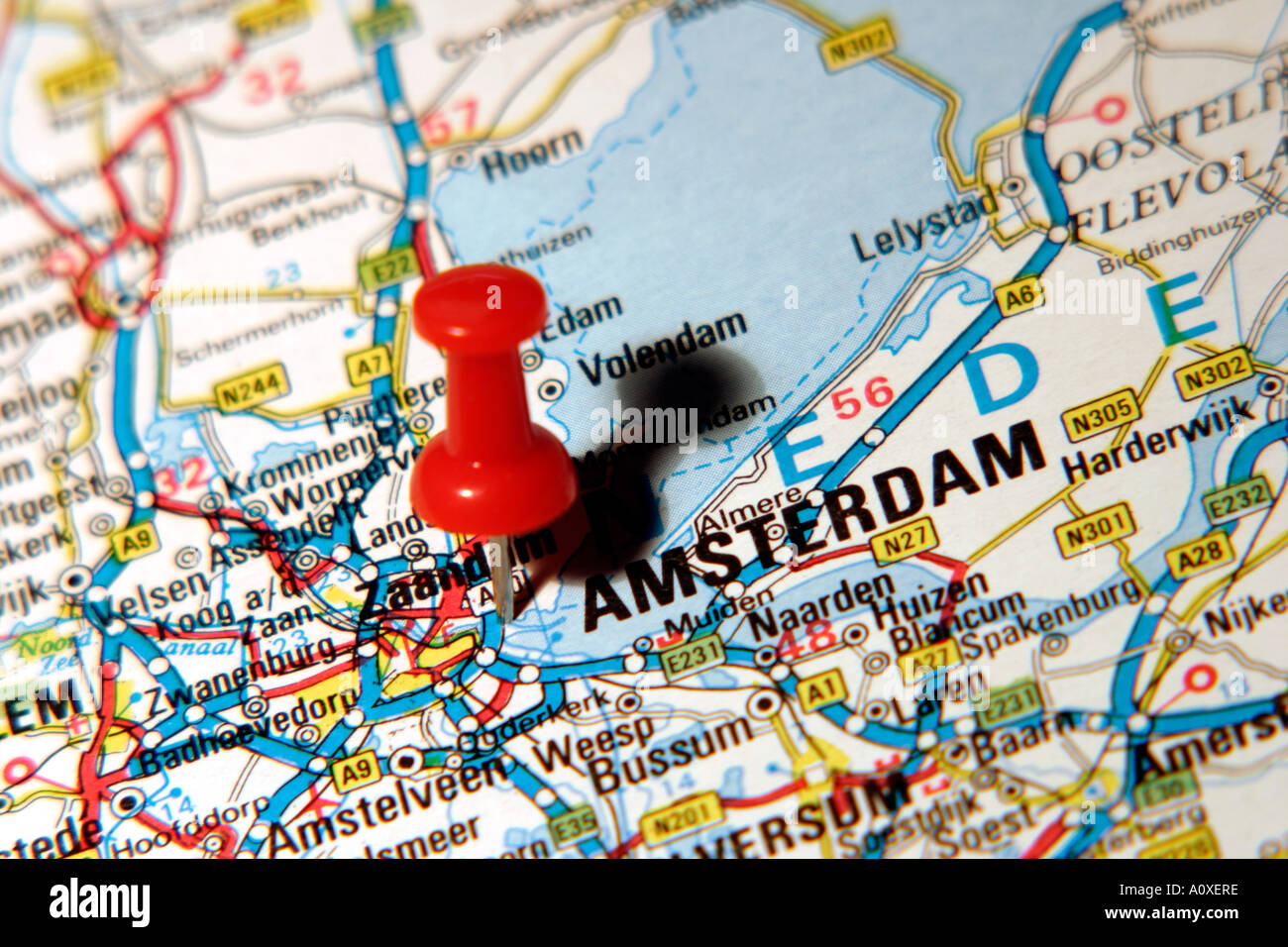 Map Pin pointing to Amsterdam , Holland on a road map Stock Photo