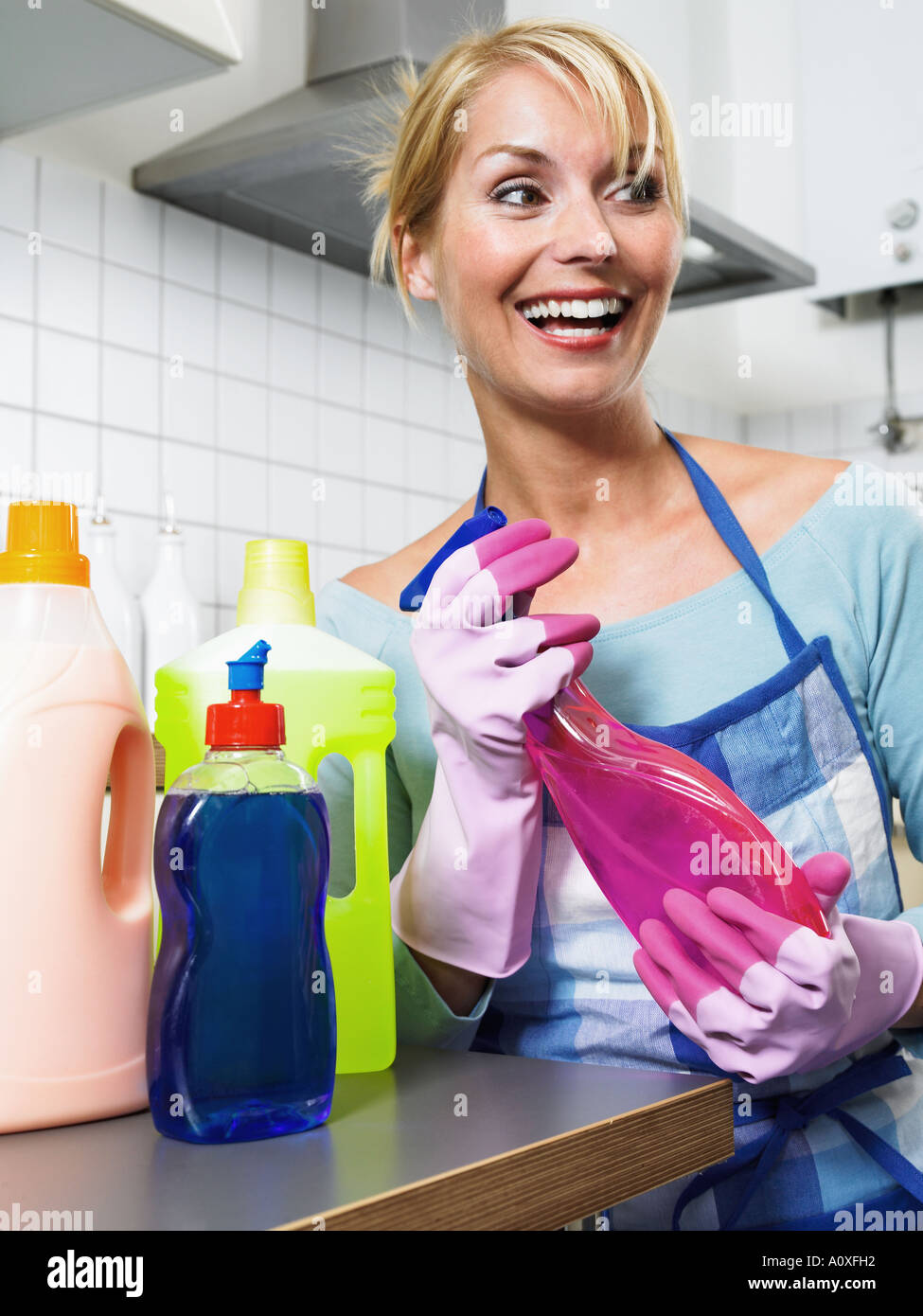 Housewife with cleaning products Stock Photo - Alamy