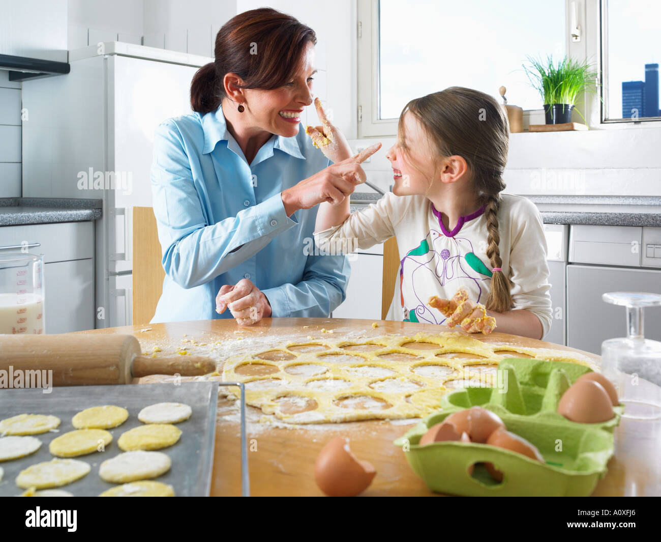 Mother and daughter having fun baking Stock Photo