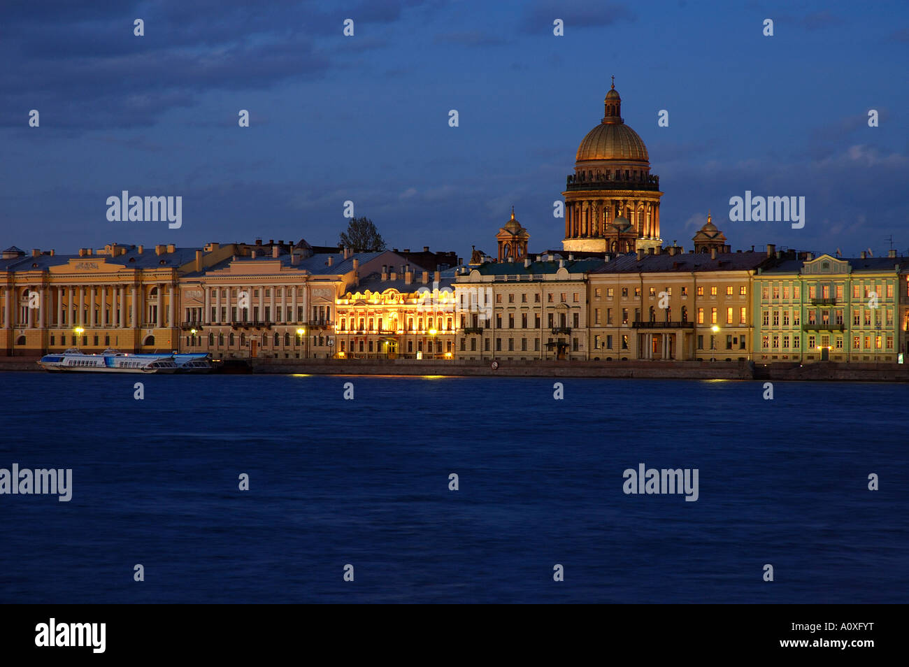 View on the Newa waterside at sundown, cupola of the cathedral St. Isaac , Saint Petersburg , Russia , East Europe Stock Photo