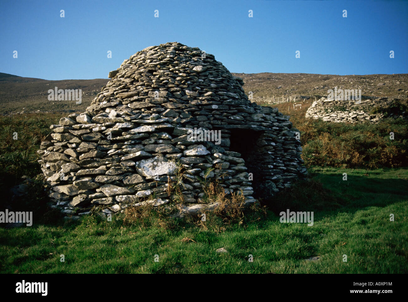 Ancient Roman beehive huts Slea Head Dingle Peninsula County Kerry Munster Eire Republic of Ireland Europe Stock Photo