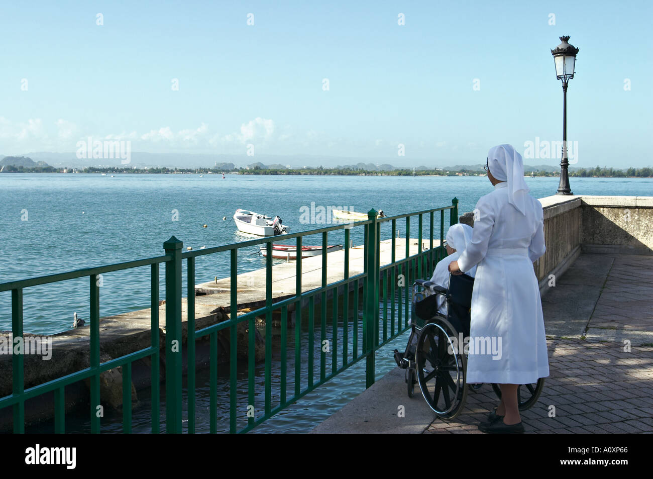 PUERTO RICO San Juan Nun in white habit wheel nun in wheelchair look