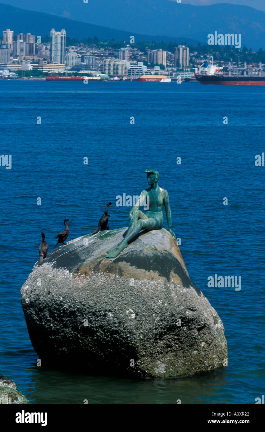 Statue of a girl in a wet suit with Vancouver Harbour Stock Photo Alamy