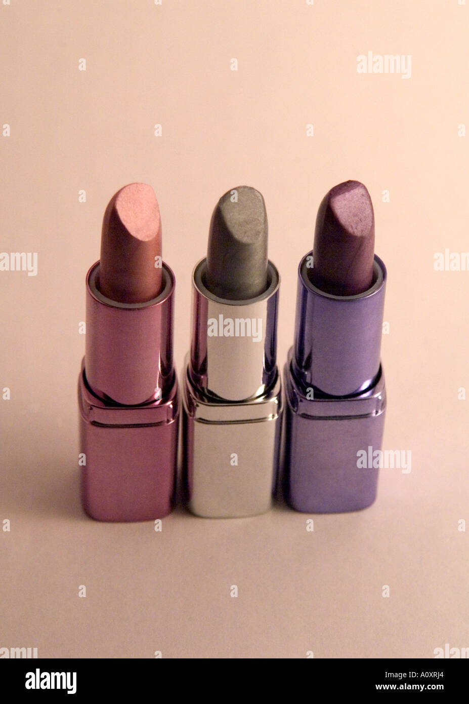 Three Lipsticks Standing Up Stock Photo Alamy
