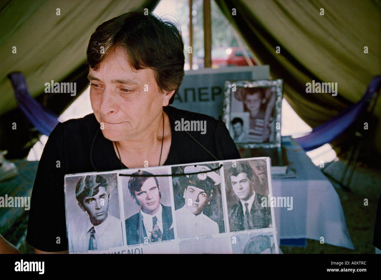 South Nicosia, Cyprus.  Androulla Aristodemou outside Ledra Palace with photos of missing loved ones Stock Photo