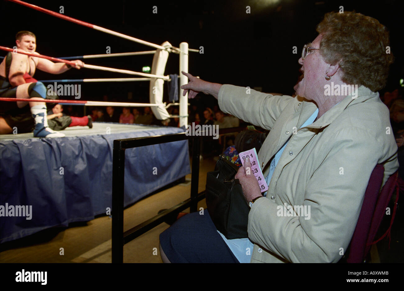 Pavilion Theatre, Worthing, England, UK Ringside wrestling fan yelling disapproval at foul play. Stock Photo