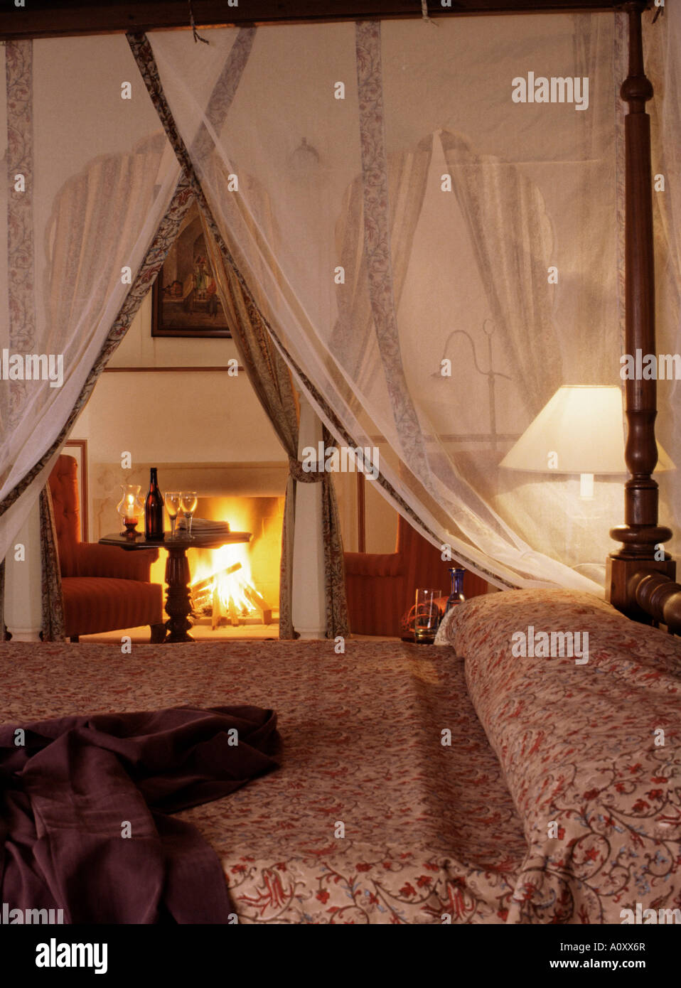 Guest Bedroom With Roaring Log Fire Lit During The Winter