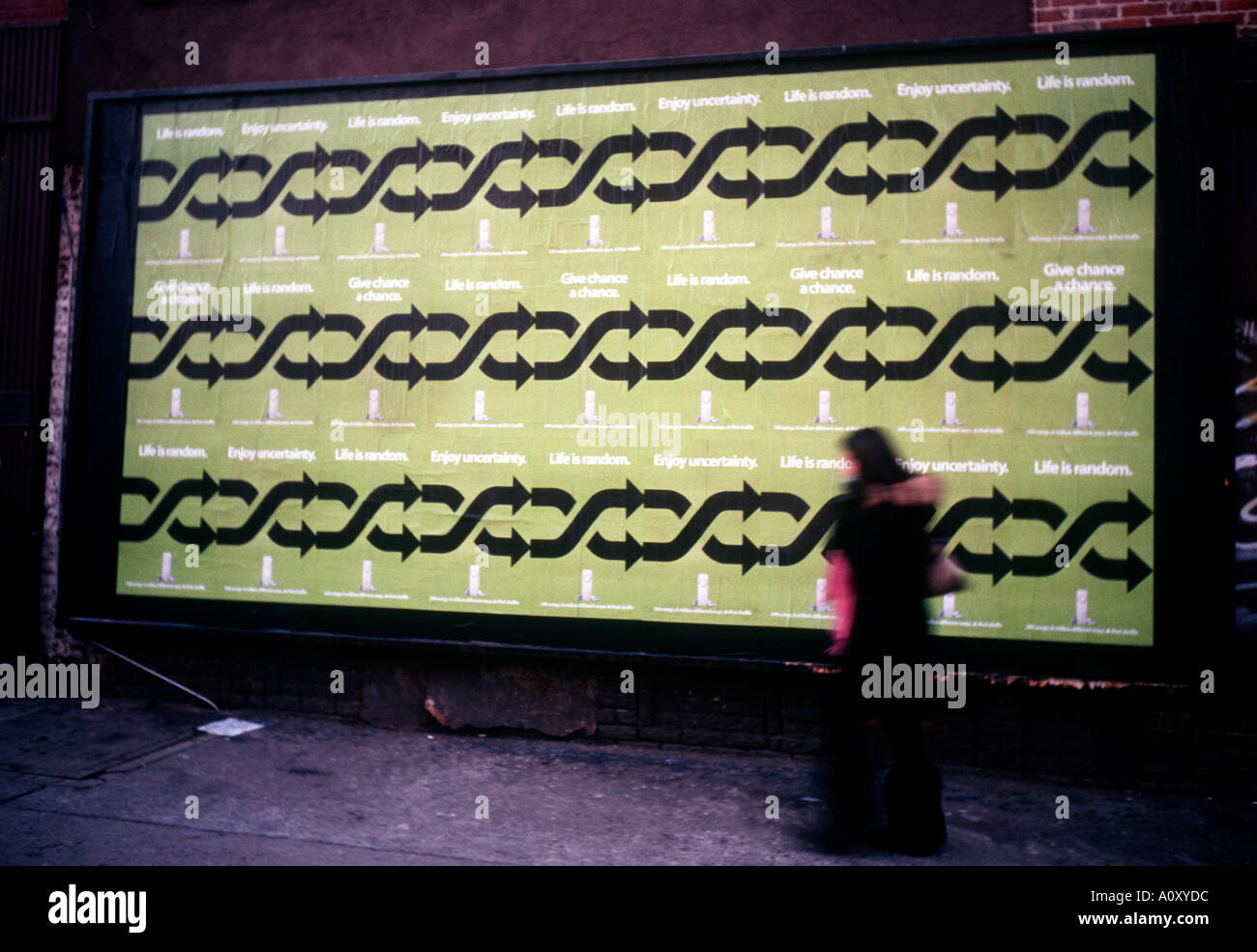 A passerby walks in front of an advertisement for the new Apple Computer iPod Shuffle Stock Photo