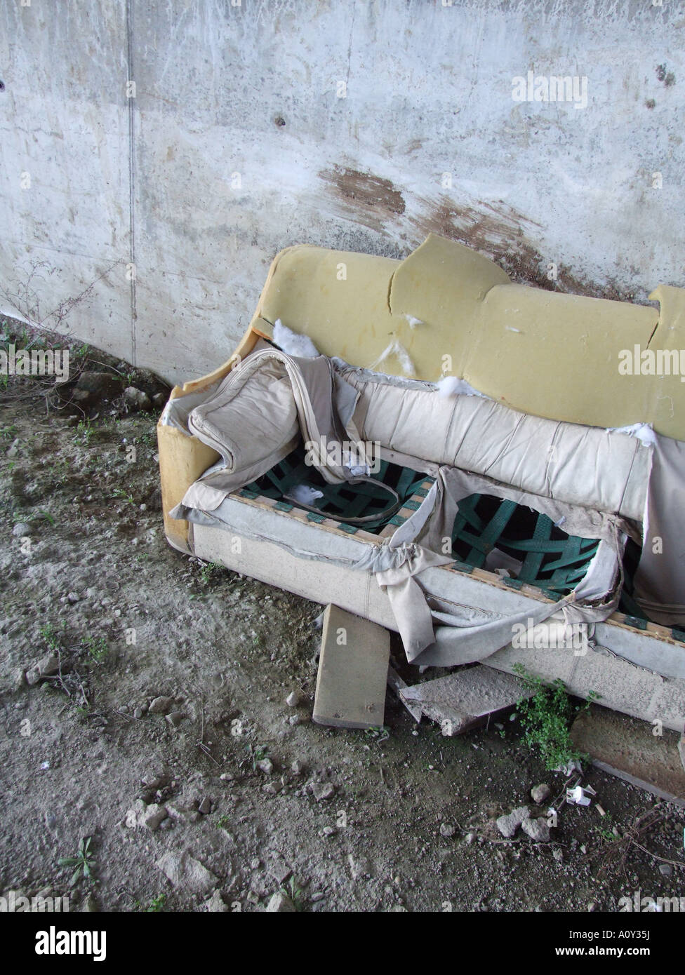 old sofa dumped on derelict ground Stock Photo Alamy