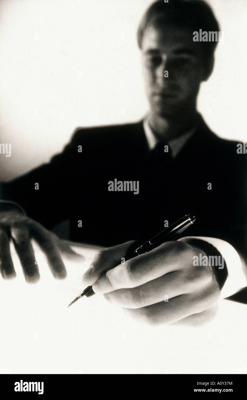 Close-up of a businessman writing with a pen Stock Photo - Alamy