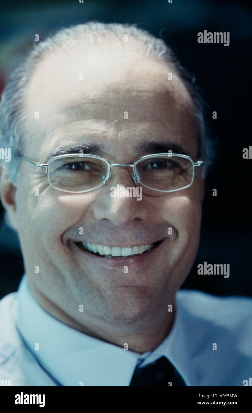 Portrait of a businessman smiling Stock Photo - Alamy