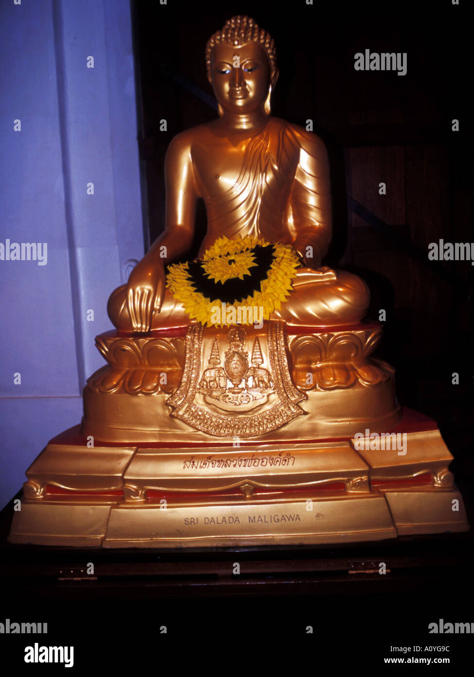 Golden Buddah statue inside the Temple of the Tooth at Kandy Sri Lanka Stock Photo