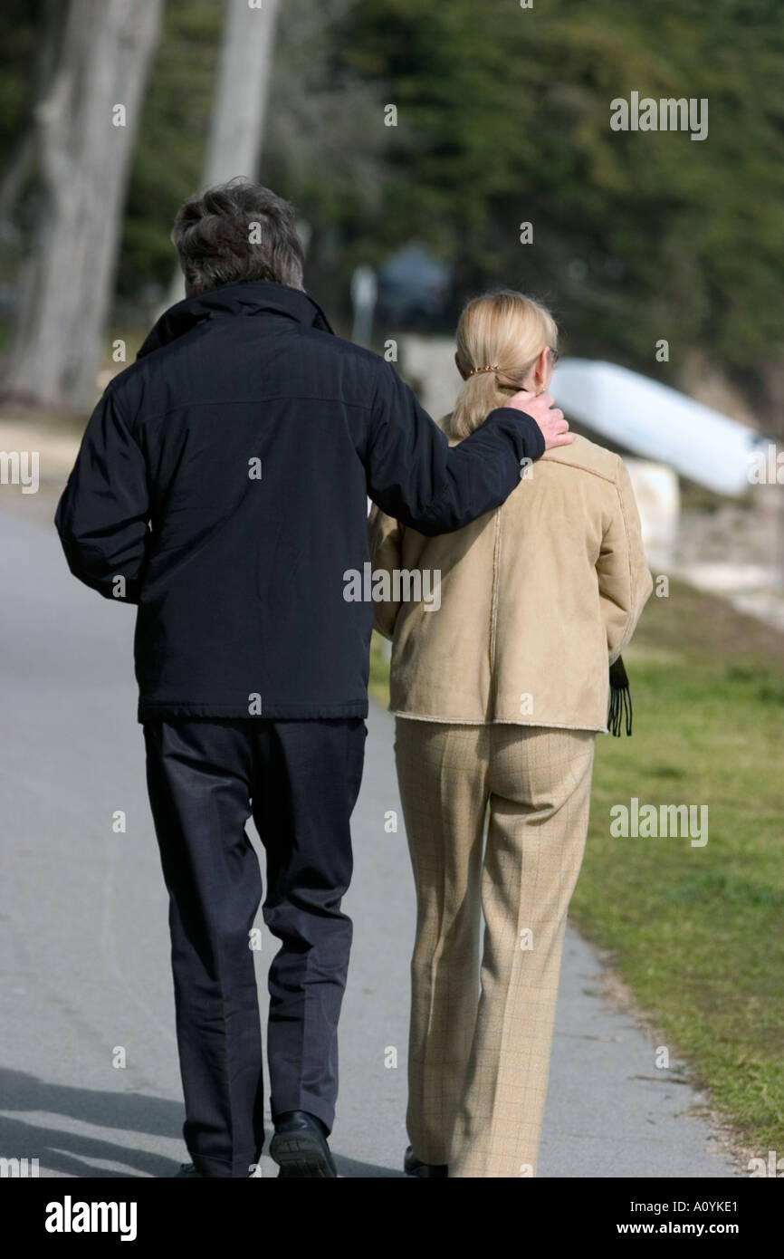 couple walking on a way road in france Stock Photo