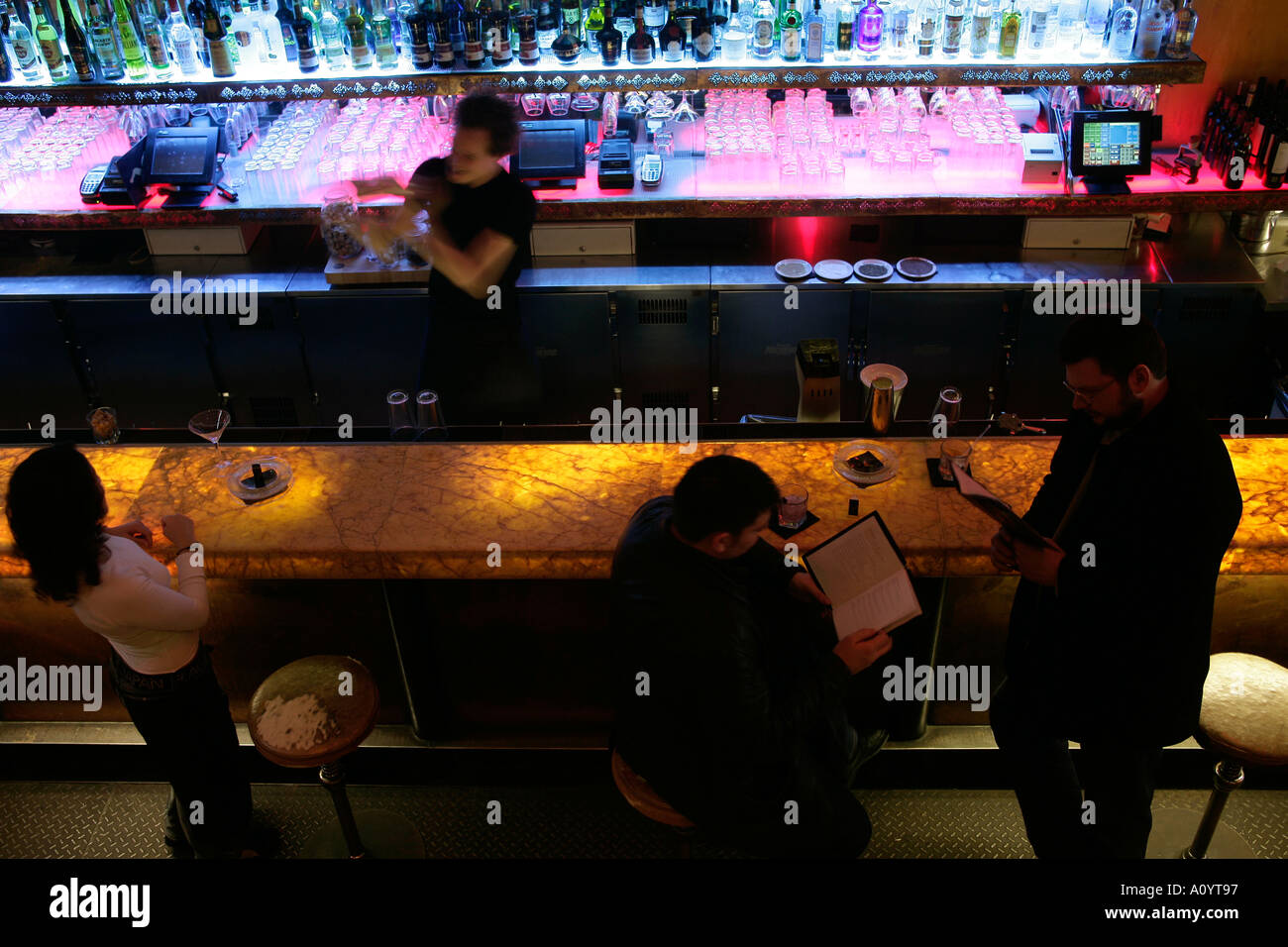 people sitting at the bar in a club Stock Photo Alamy