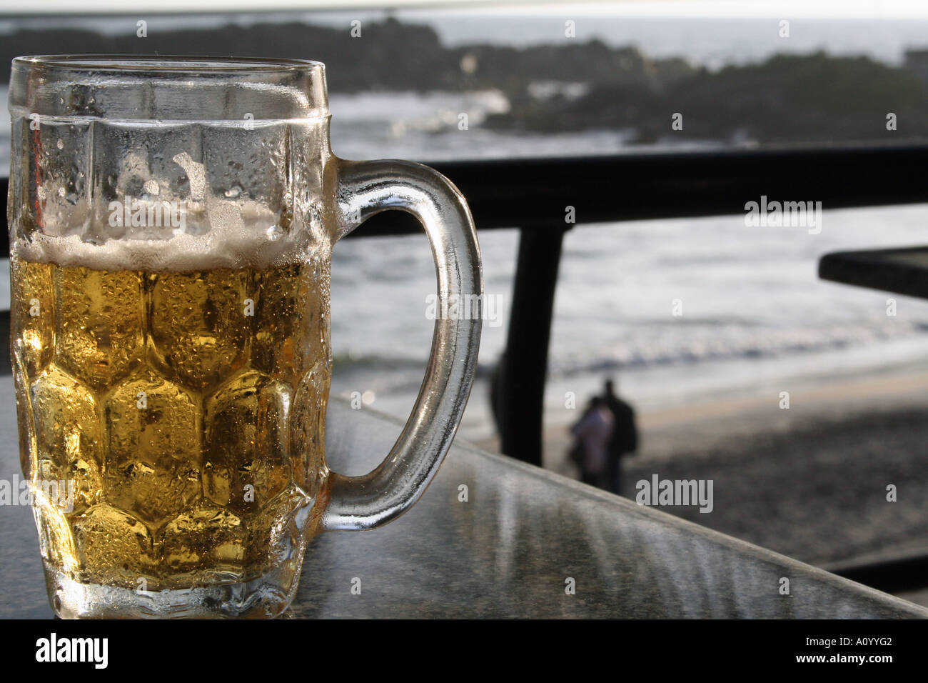 Glass of beer overlooking the sea in fusion bar, Kovalam , india Stock Photo