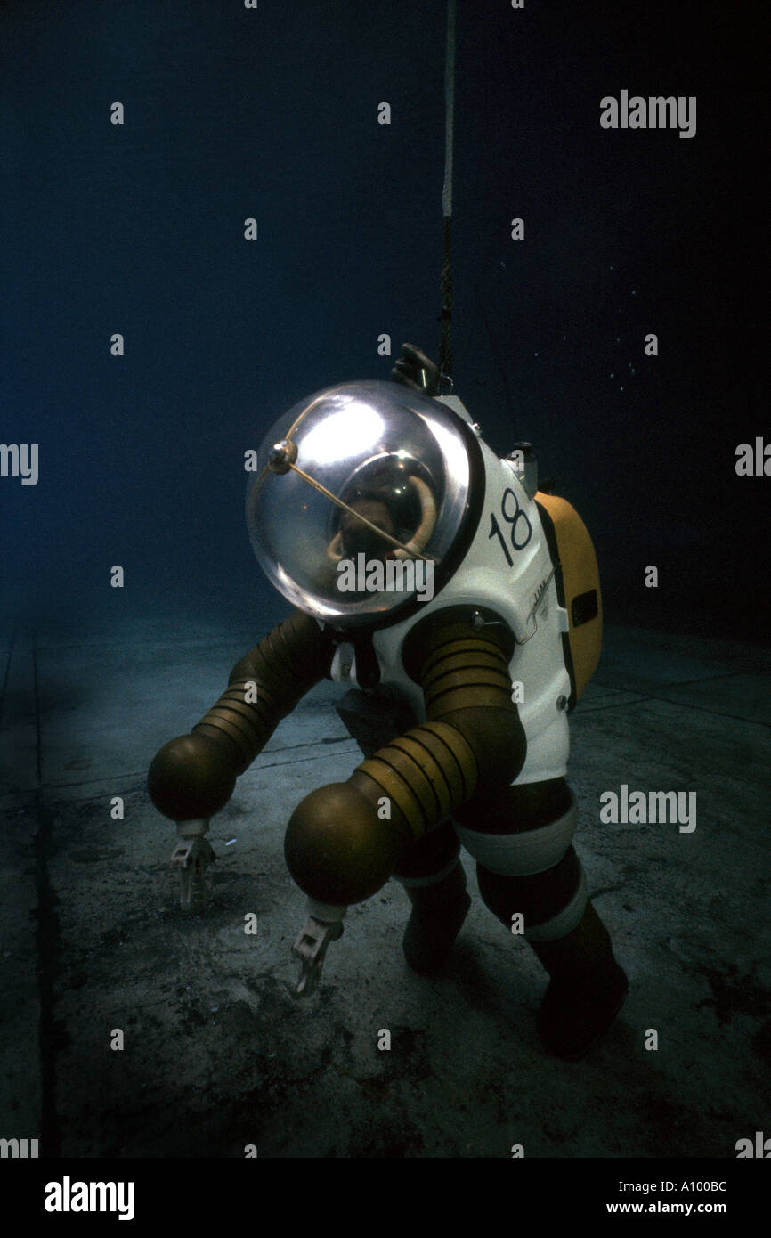 Deep sea diver in armoured suit carries out research Stock Photo
