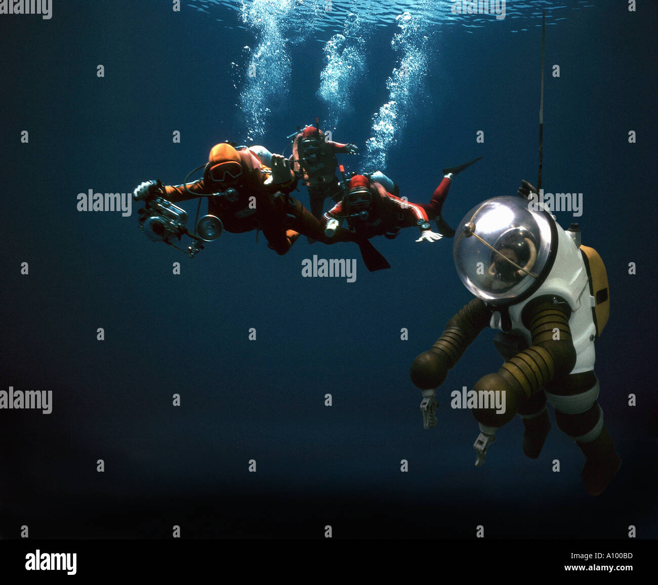three sub aqua divers in Mediterranean with deep sea research diver Stock Photo