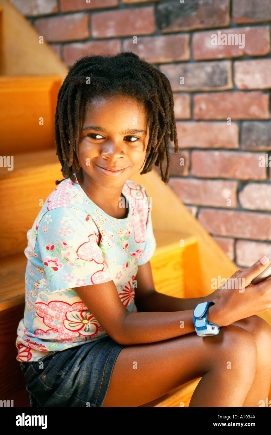 Young African girl smiling Stock Photo - Alamy