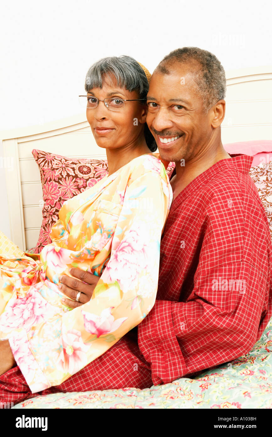 Middleaged African couple embracing in their bedroom Stock Photo Alamy