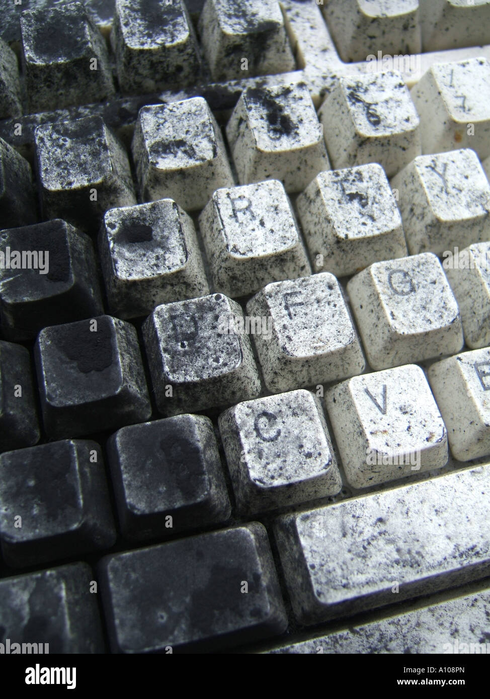computer keyboard covered with black photocopier toner ink Stock Photo