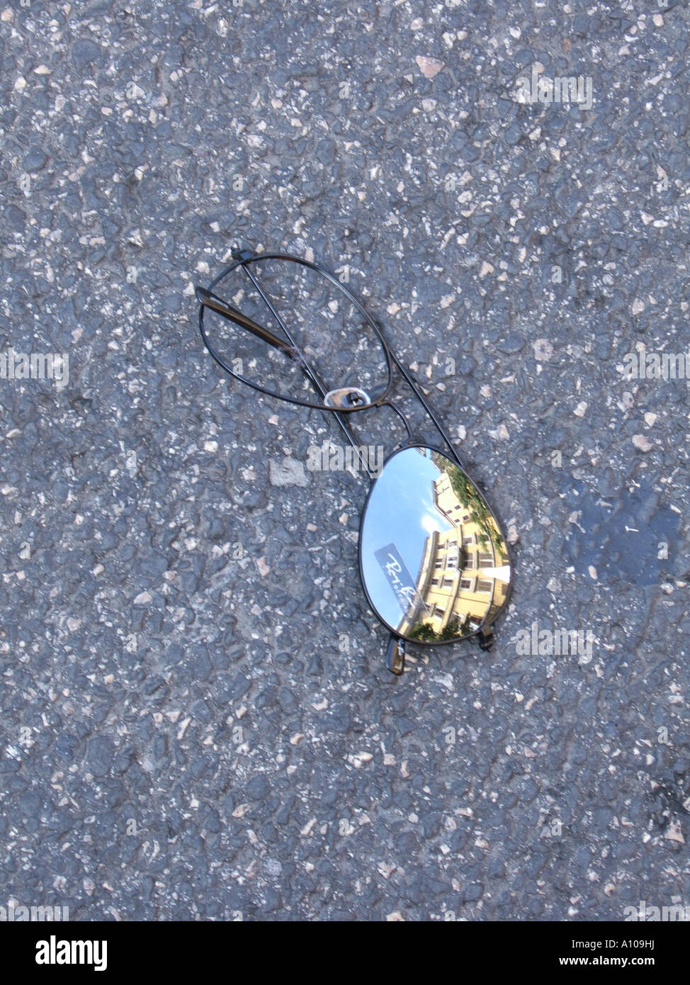 broken sunglasses on road Stock Photo - Alamy