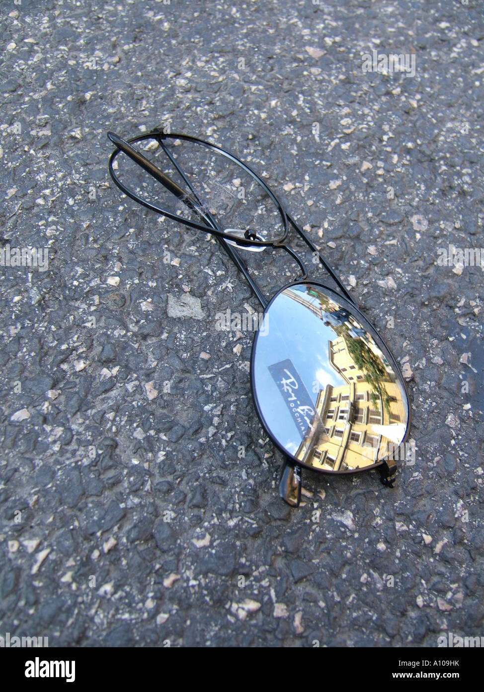 broken sunglasses on road Stock Photo - Alamy
