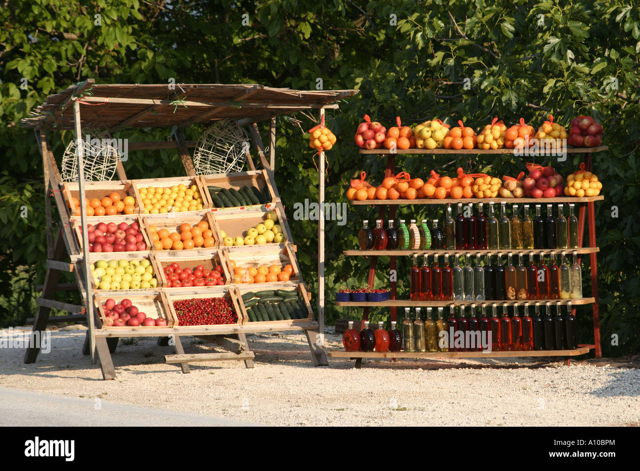 Local fruit and fruit based liquors for sale near Opuzen on the road to Dubrovnik Stock Photo