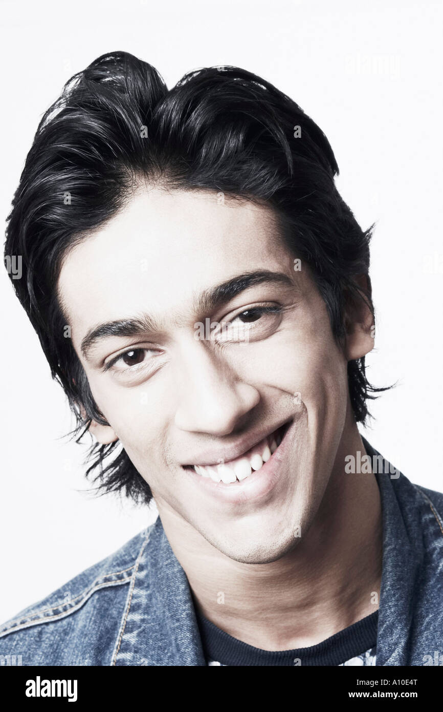 Portrait of a young man smiling Stock Photo - Alamy