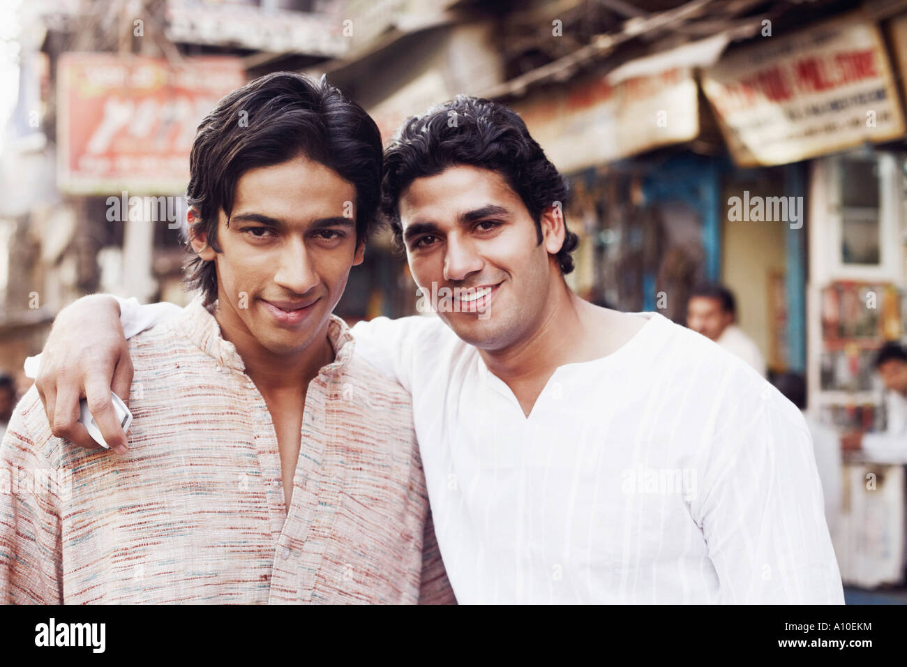 Portrait of two young men smiling Stock Photo - Alamy