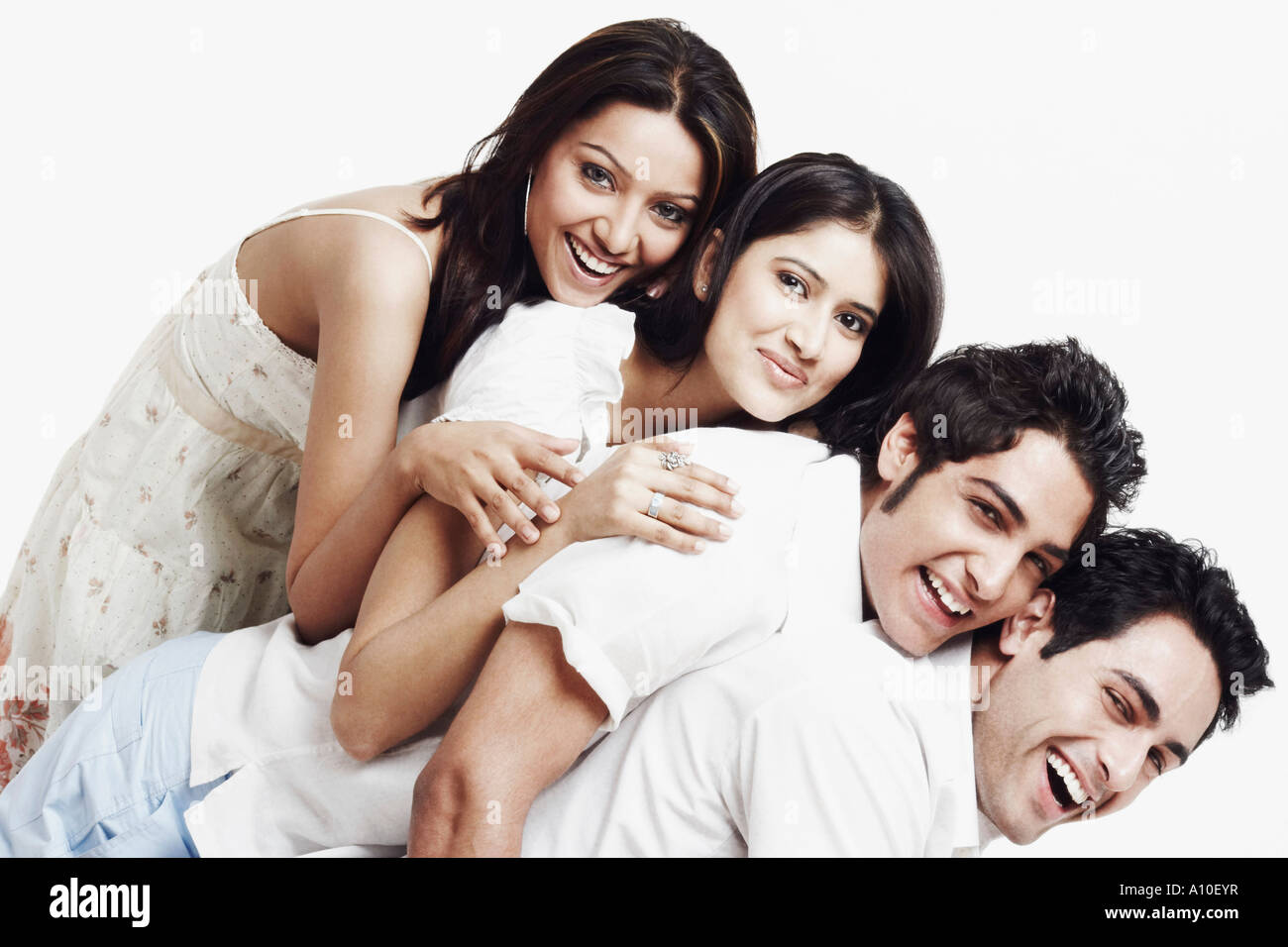 Portrait of two young women and two young men Stock Photo - Alamy