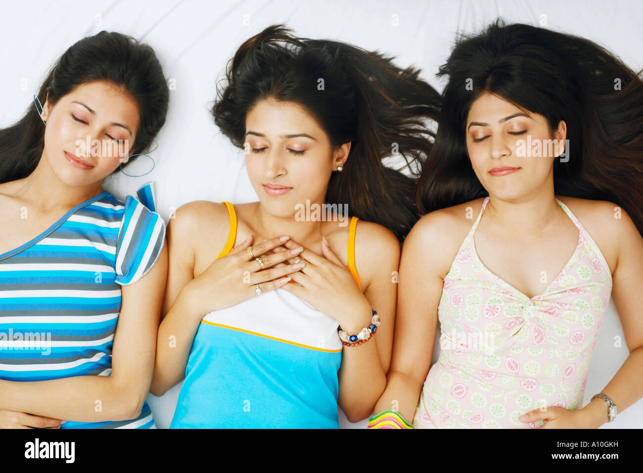 High angle view of three young women sleeping Stock Photo - Alamy