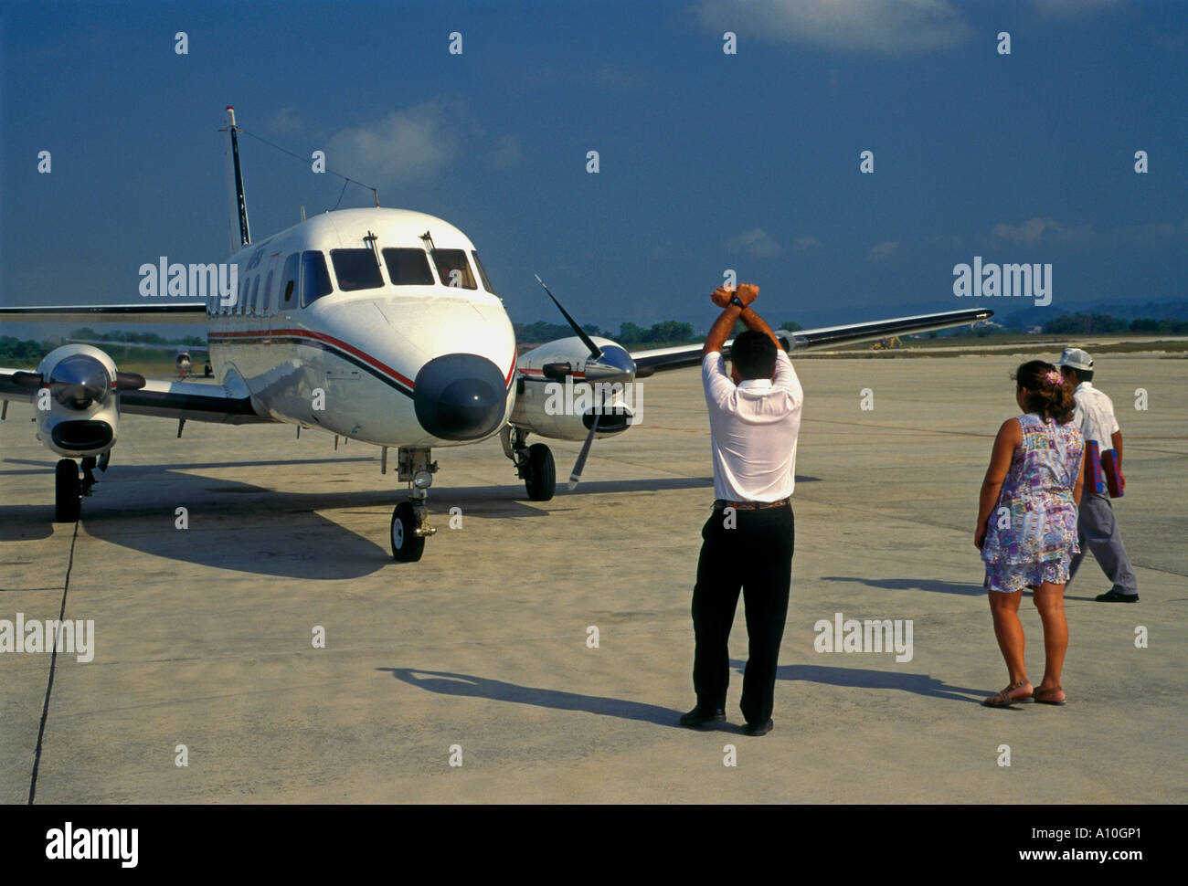 tourists, passengers, arriving, Santa Elena International Airport, Santa Elena, El Peten