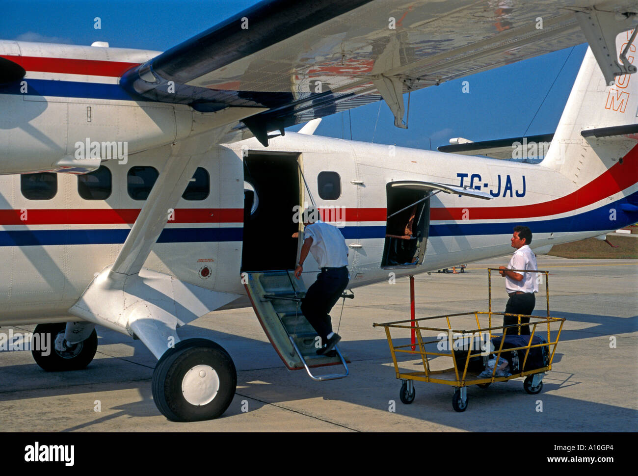 Passengers arriving at Santa Elena International Airport Santa Elena El Peten Department Guatemala Central America Stock Photo