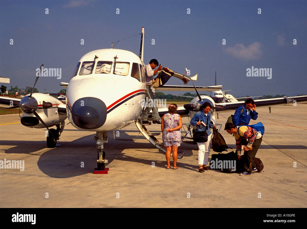 tourists, passengers, arriving, Santa Elena International Airport, Santa Elena, El Peten Department, Guatemala, Central America Stock Photo