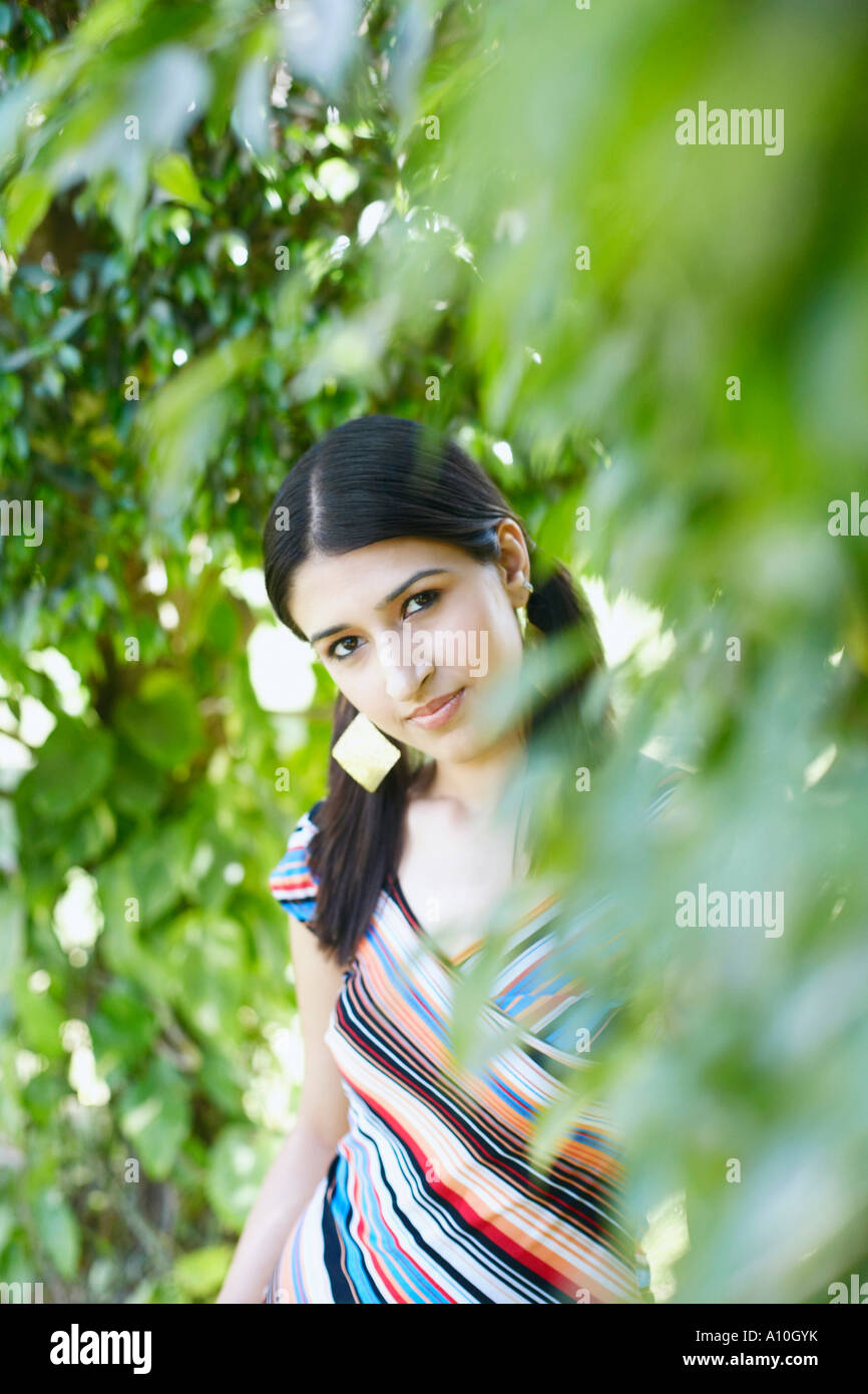 Portrait of a young woman standing Stock Photo - Alamy