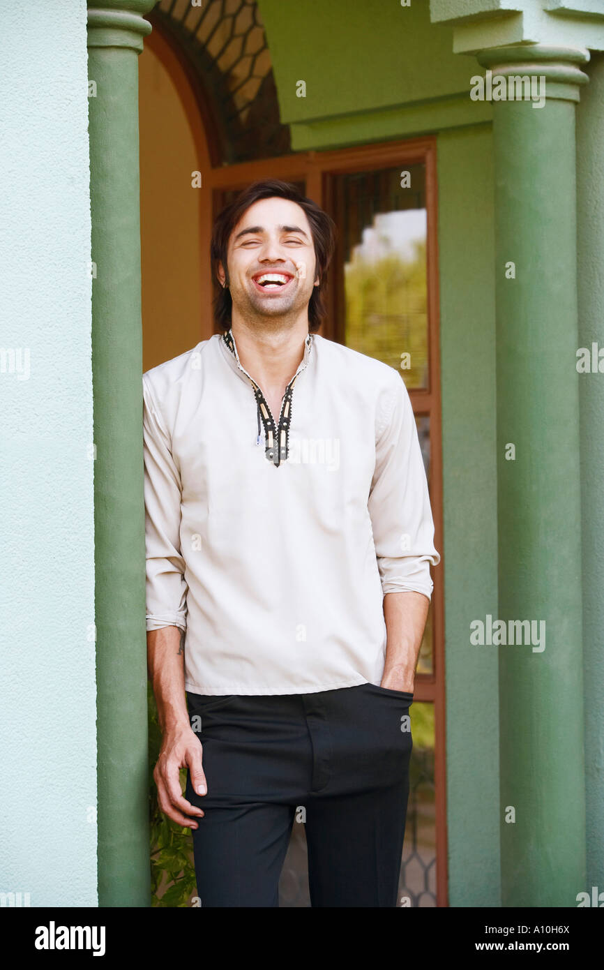 Portrait of a young man laughing Stock Photo - Alamy