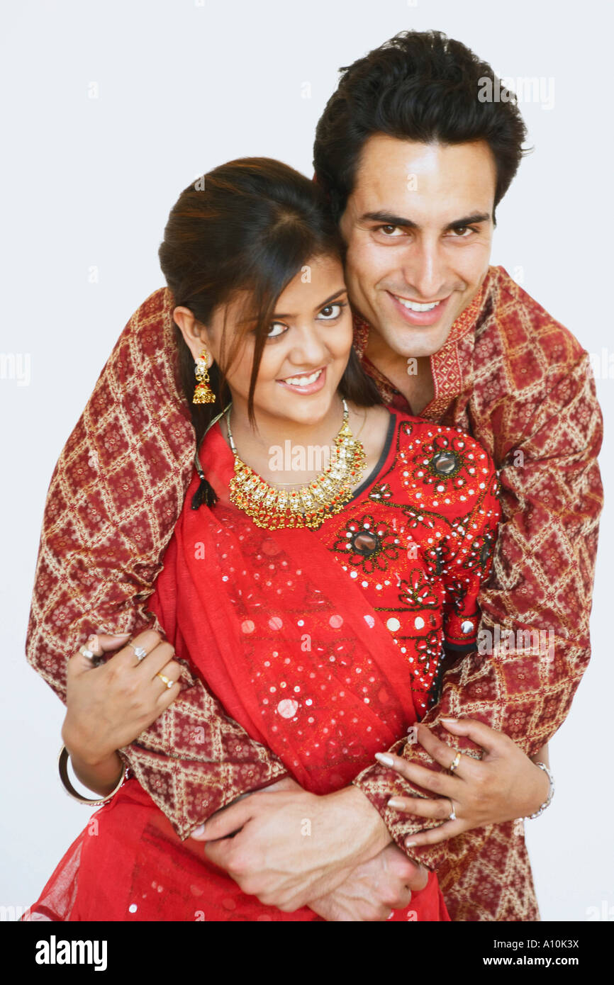 Portrait of a young man embracing a young woman Stock Photo - Alamy