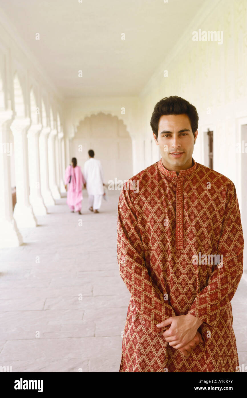 Portrait of a young man standing Stock Photo - Alamy