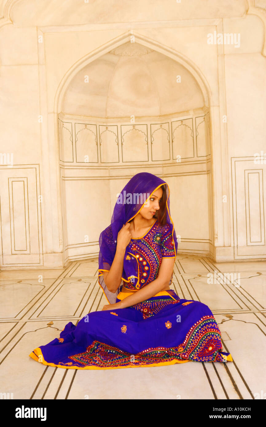 Young woman sitting on the floor Stock Photo - Alamy